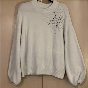 White sweater with Jem detail